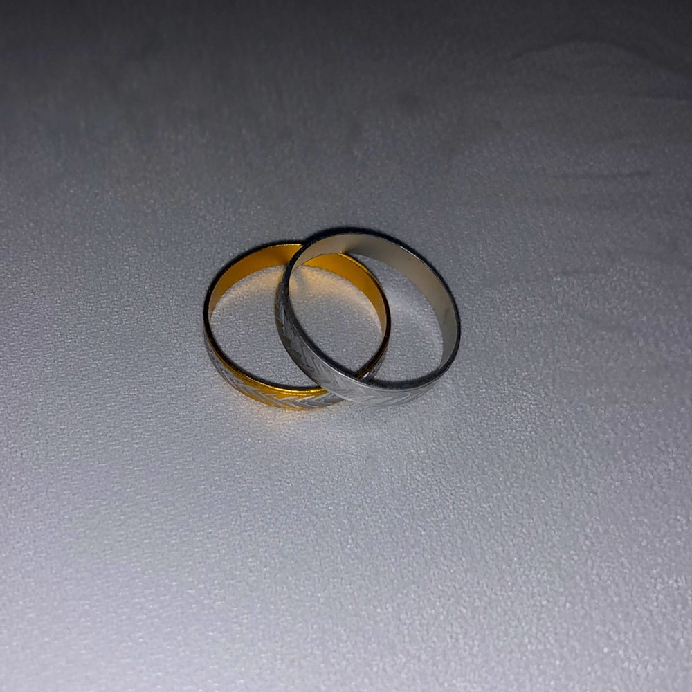 Gold and silver rings and Metal two of them